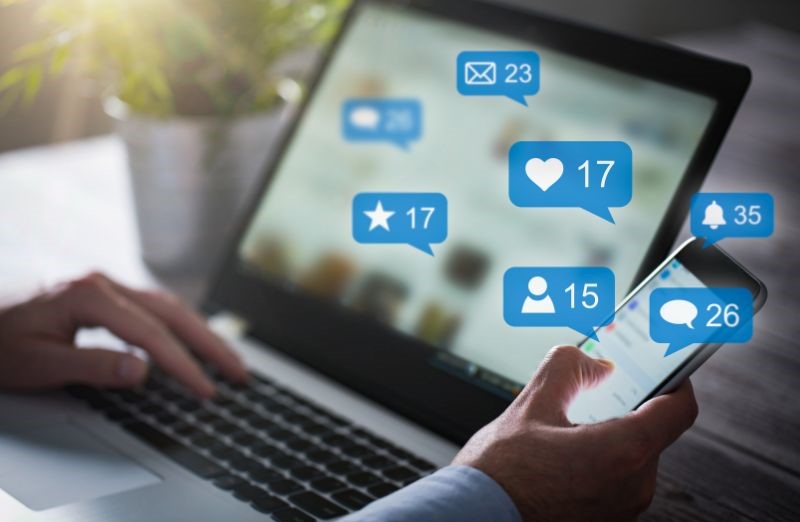 A laptop showing social media likes representing communication with public officials